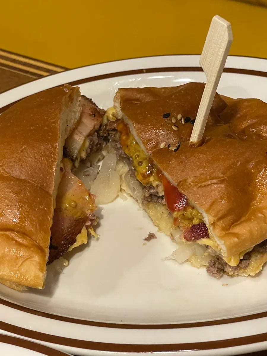 Cross-section of the bacon cheese burger showing the bacon