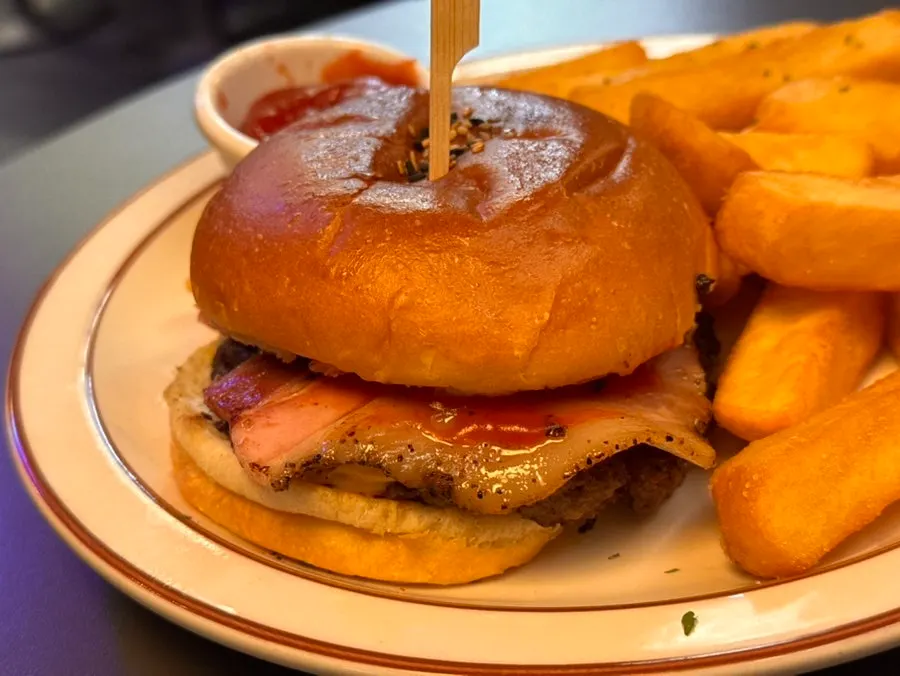 Close-up cross-section of the bacon cheeseburger