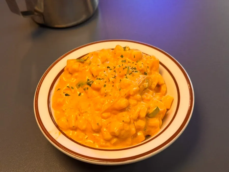 A spoonful of corn salad scooped up