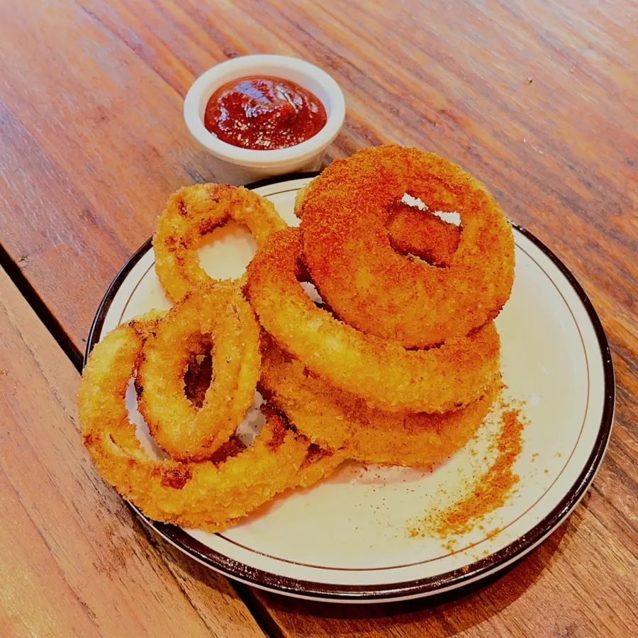 Onion rings with salsa sauce at Daily Fix
