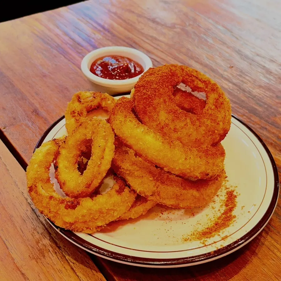 Salsa sauce served with onion rings