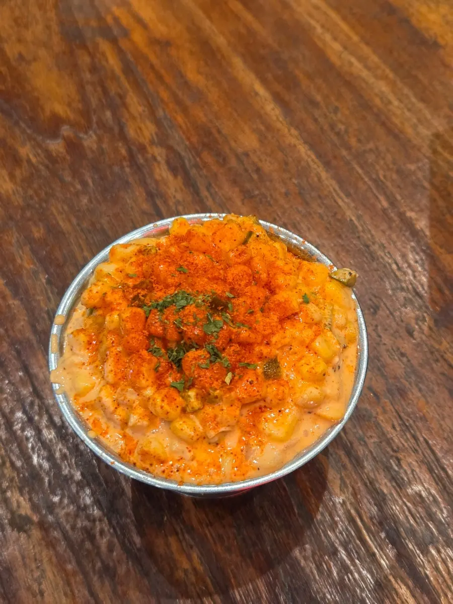Close-up spoonful of corn salad