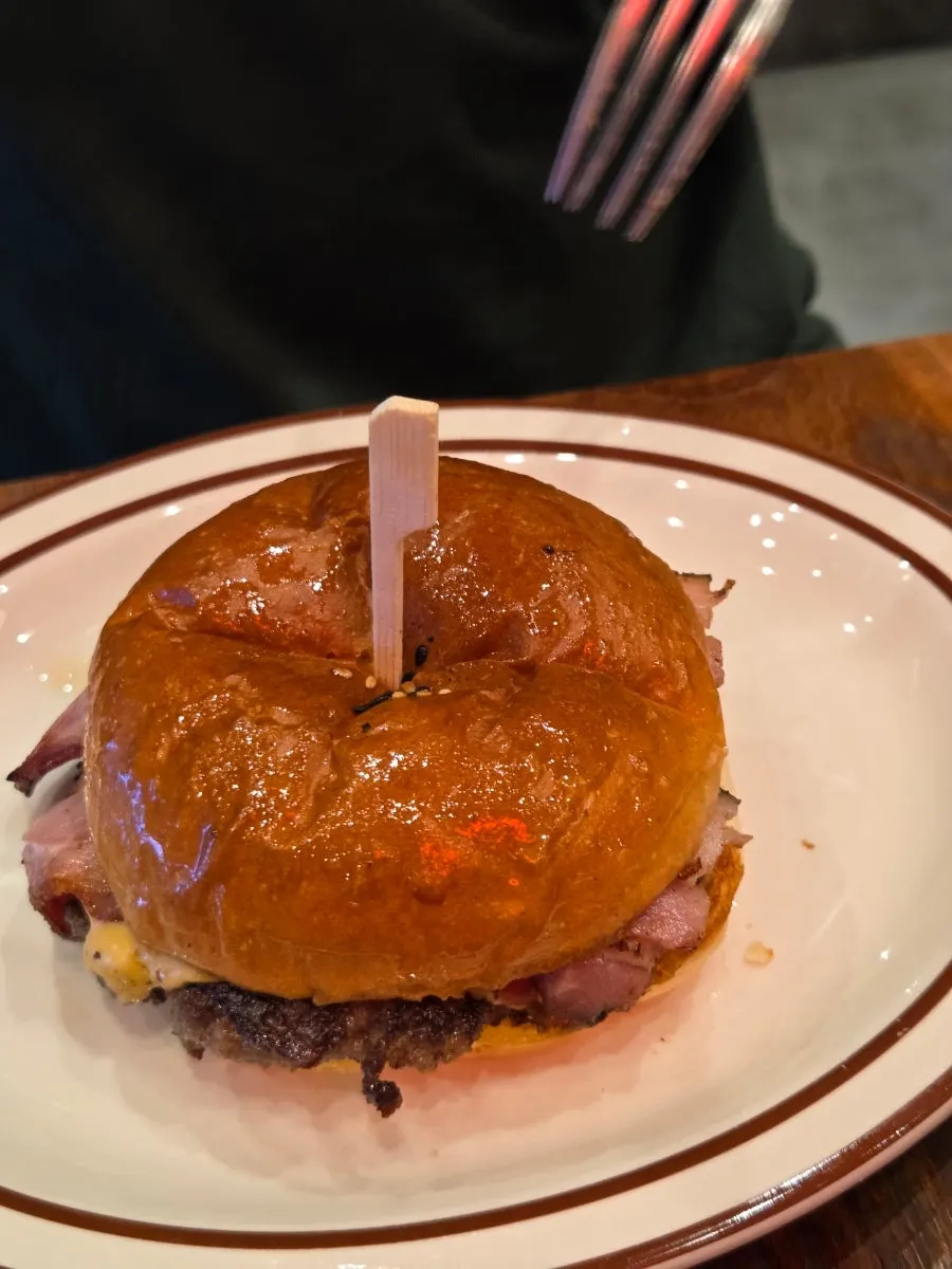 Bacon cheese burger with a bite taken