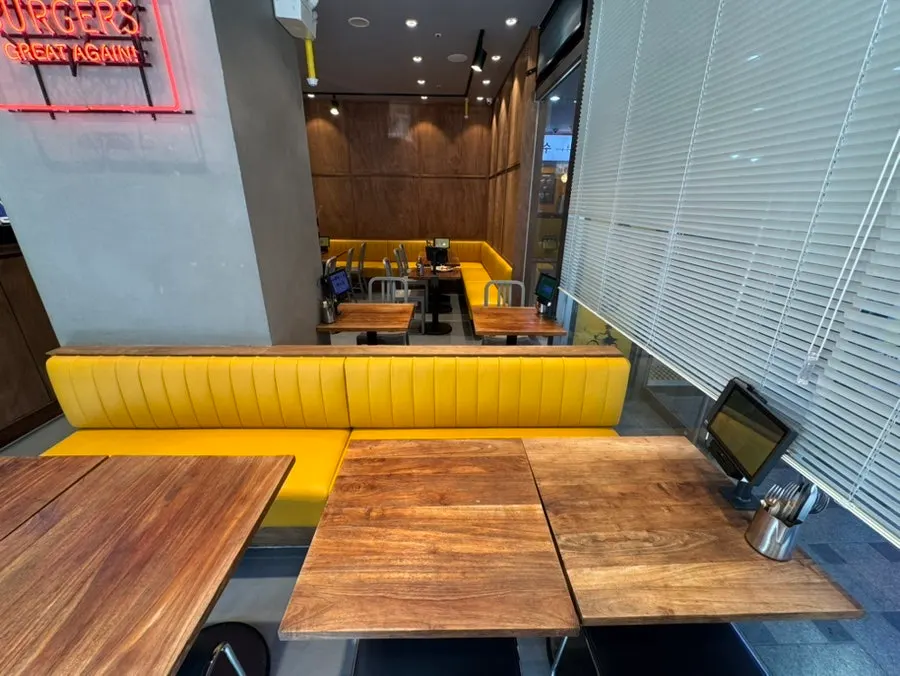 Dining hall with sofa seats and regular tables
