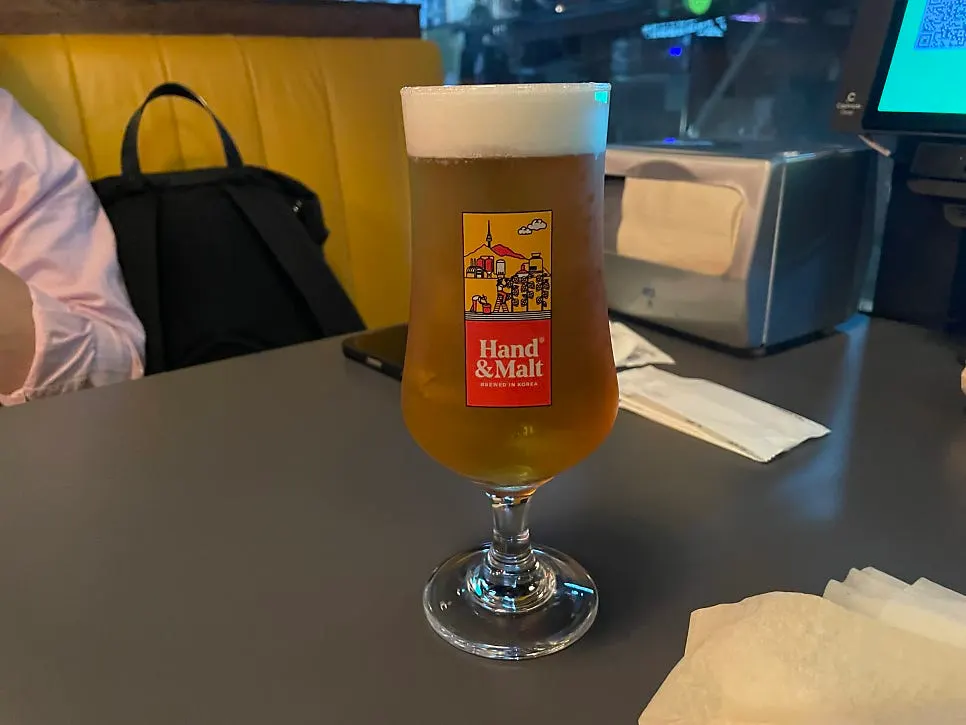 A glass of Slow IPA draft beer