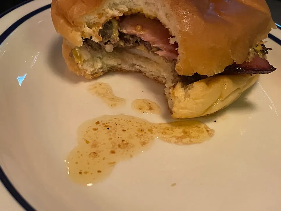 Two thick strips of bacon on the patty
