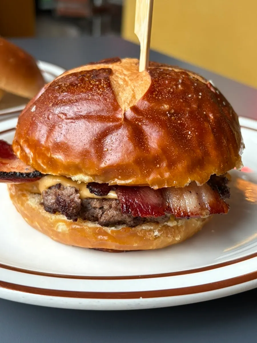 Close-up of the pretzel bun bacon cheese burger