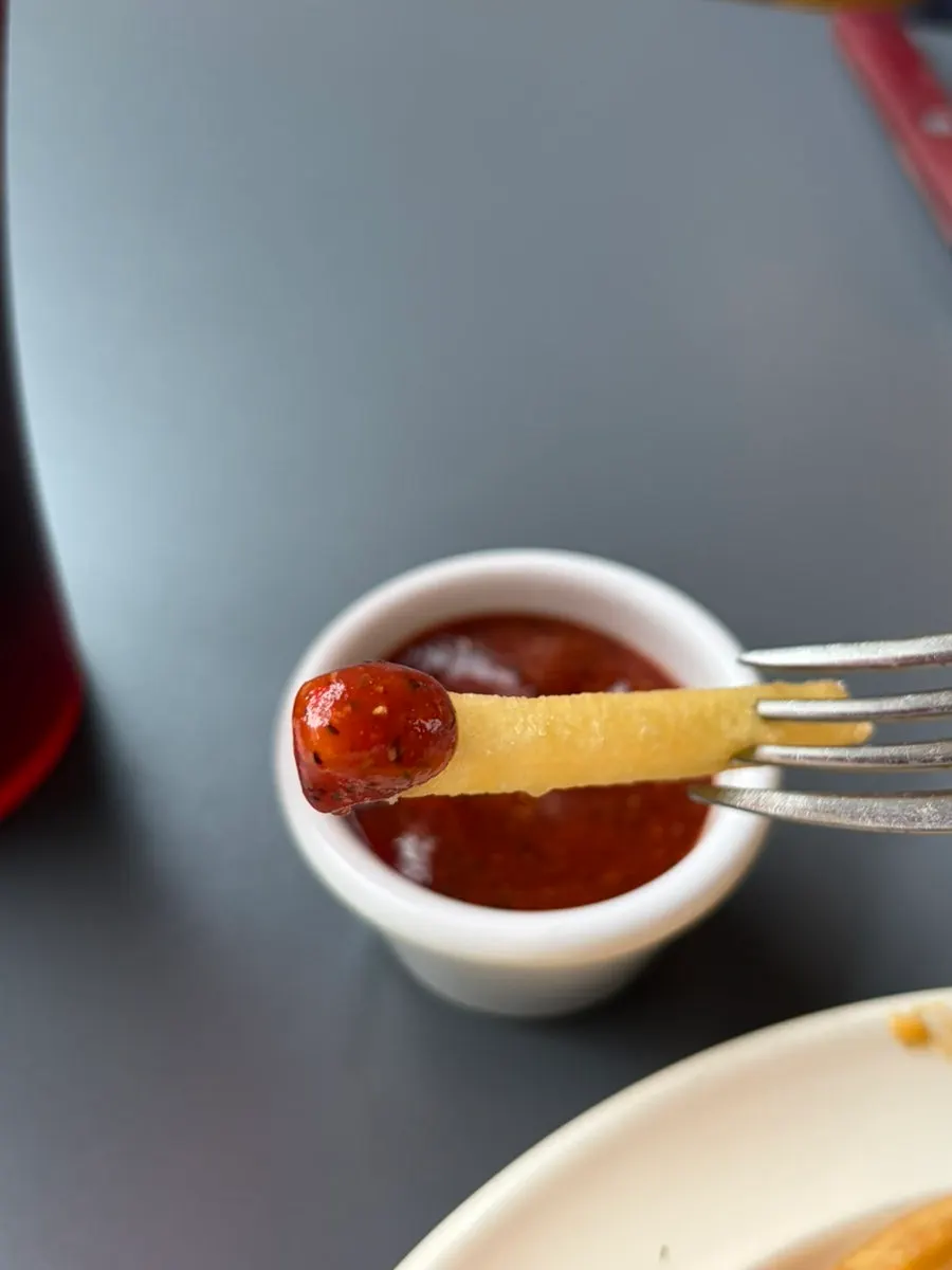 Hot ketchup dipping sauce topped with black pepper