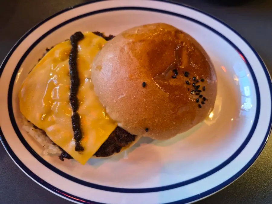 Cross-section of a bitten truffle mushroom burger