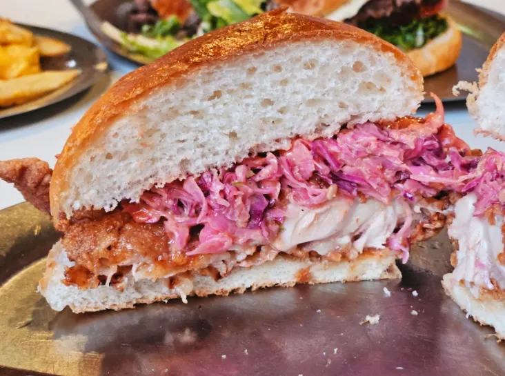 Close-up of crispy-outside, juicy-inside thigh meat chicken