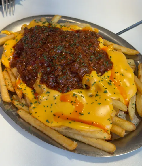 Chili cheese fries piled high with cheese sauce