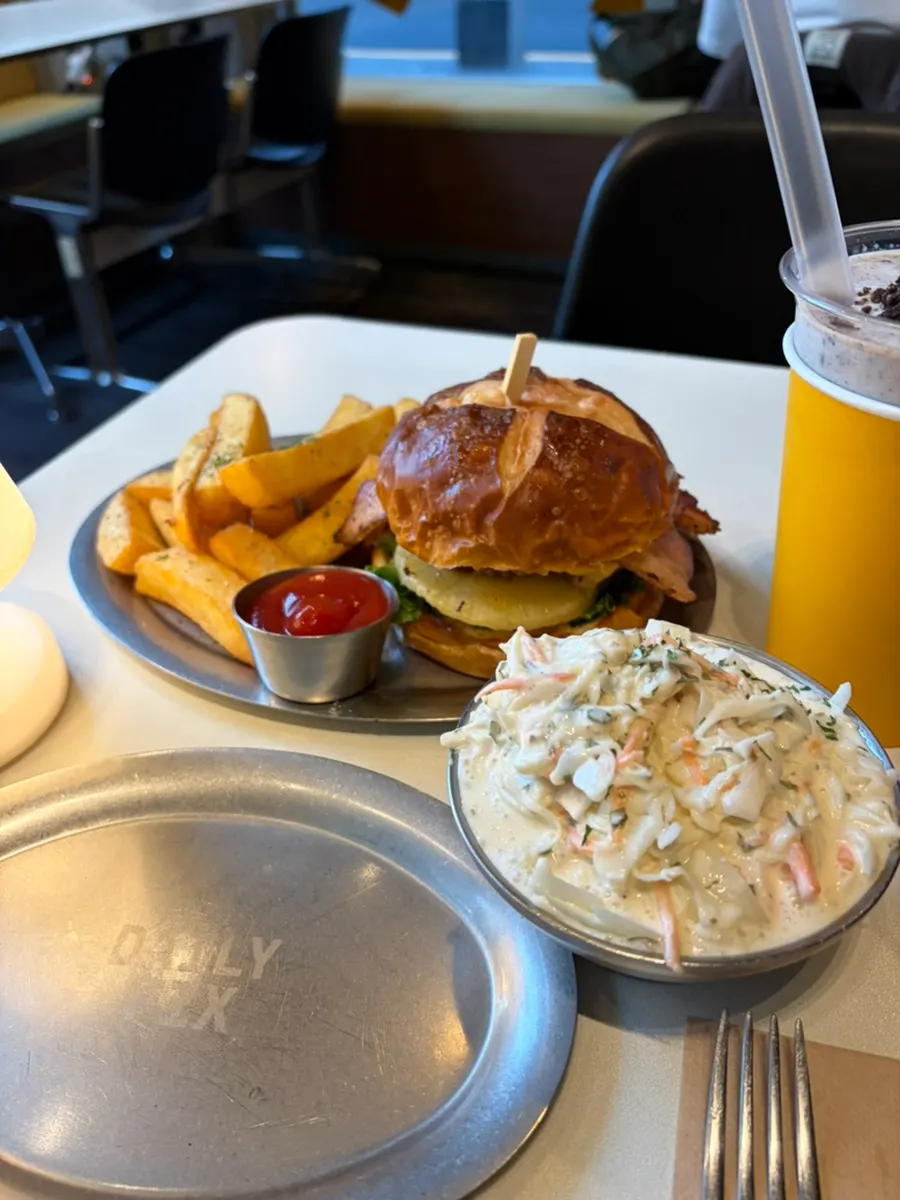 Coleslaw served alongside burger and fries