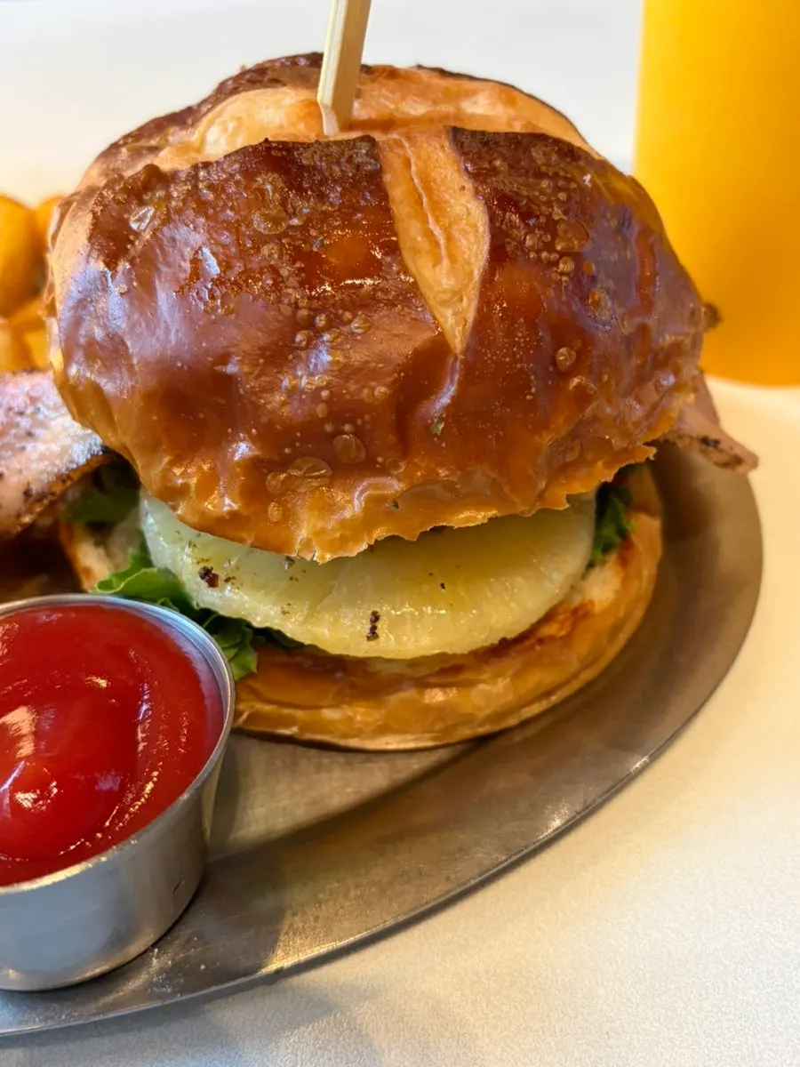 Burger showing the Korean beef patty and house-made bacon