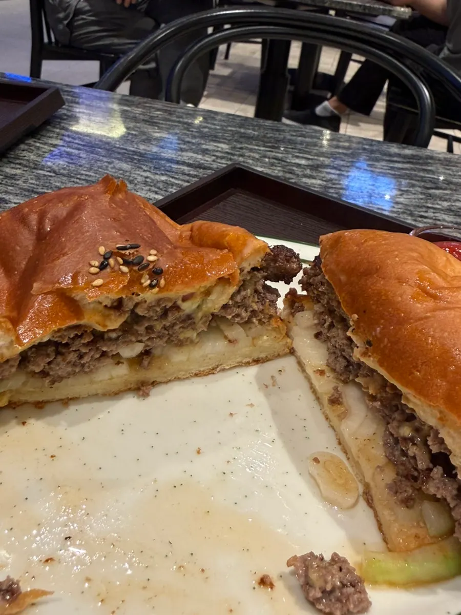 Double cheeseburger cut in half