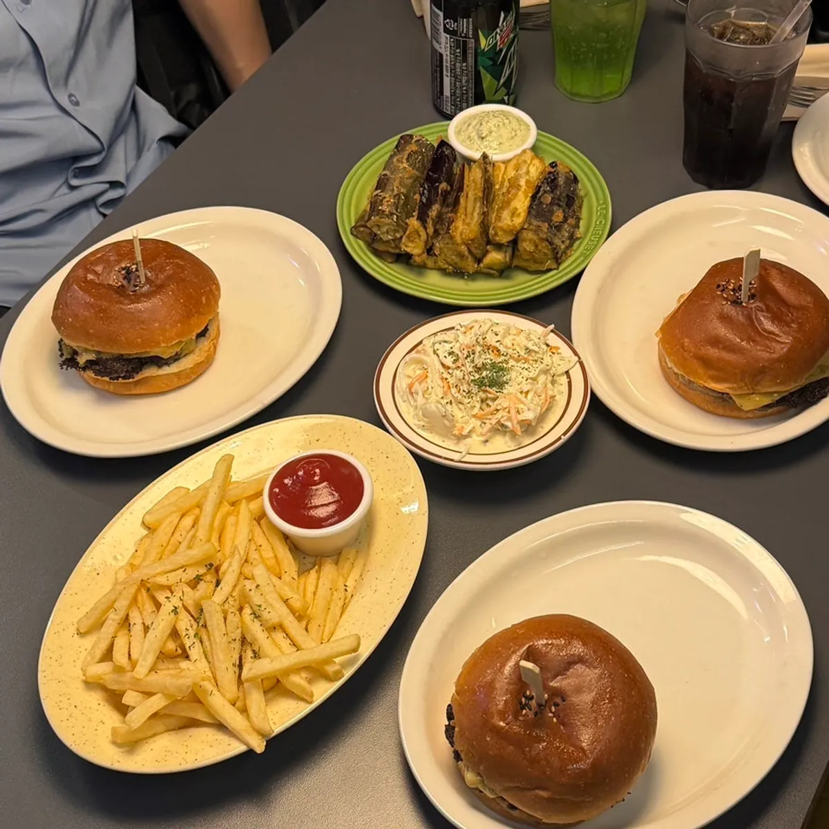 Burgers and side dishes ordered by three friends at Daily Fix