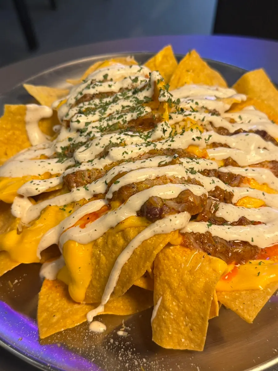 Nachos generously topped with chili cheese sauce