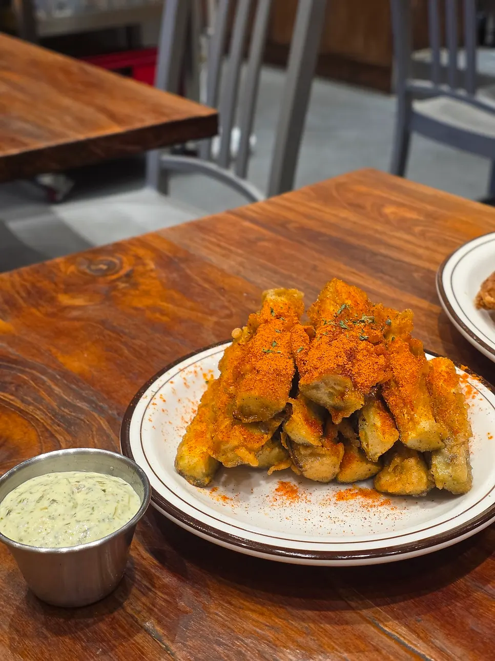 Thick eggplant fries served with green mayo sauce