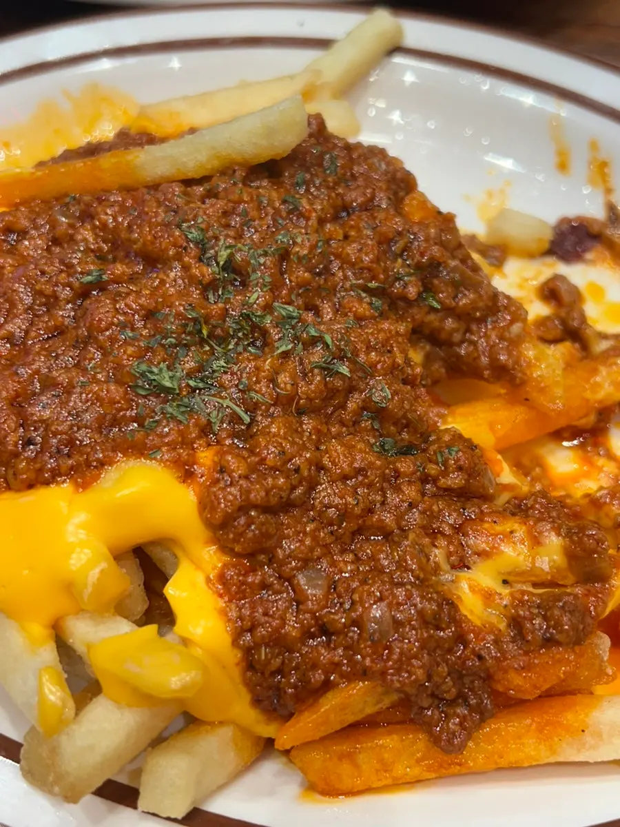 Fries topped with beef chili sauce and cheese sauce