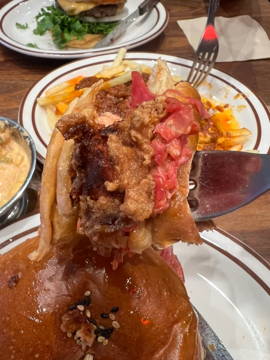 Vegetables and sauce inside the chicken burger