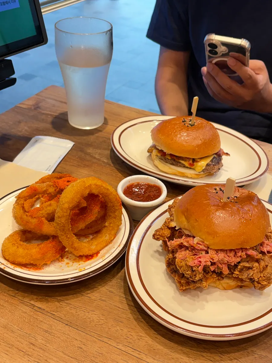 Burger and sides set up on the table