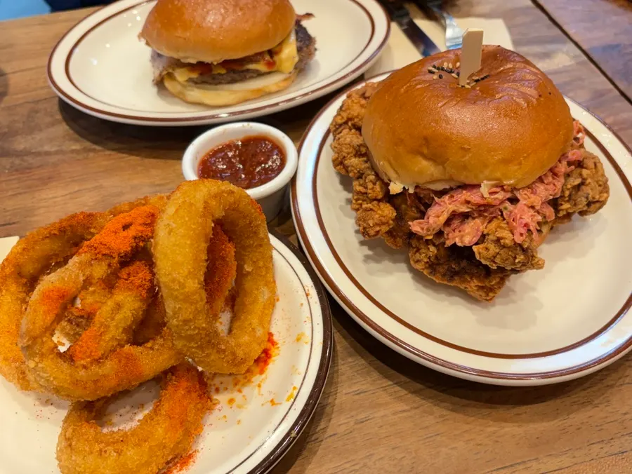 Table setting with the chicken burger and coleslaw together