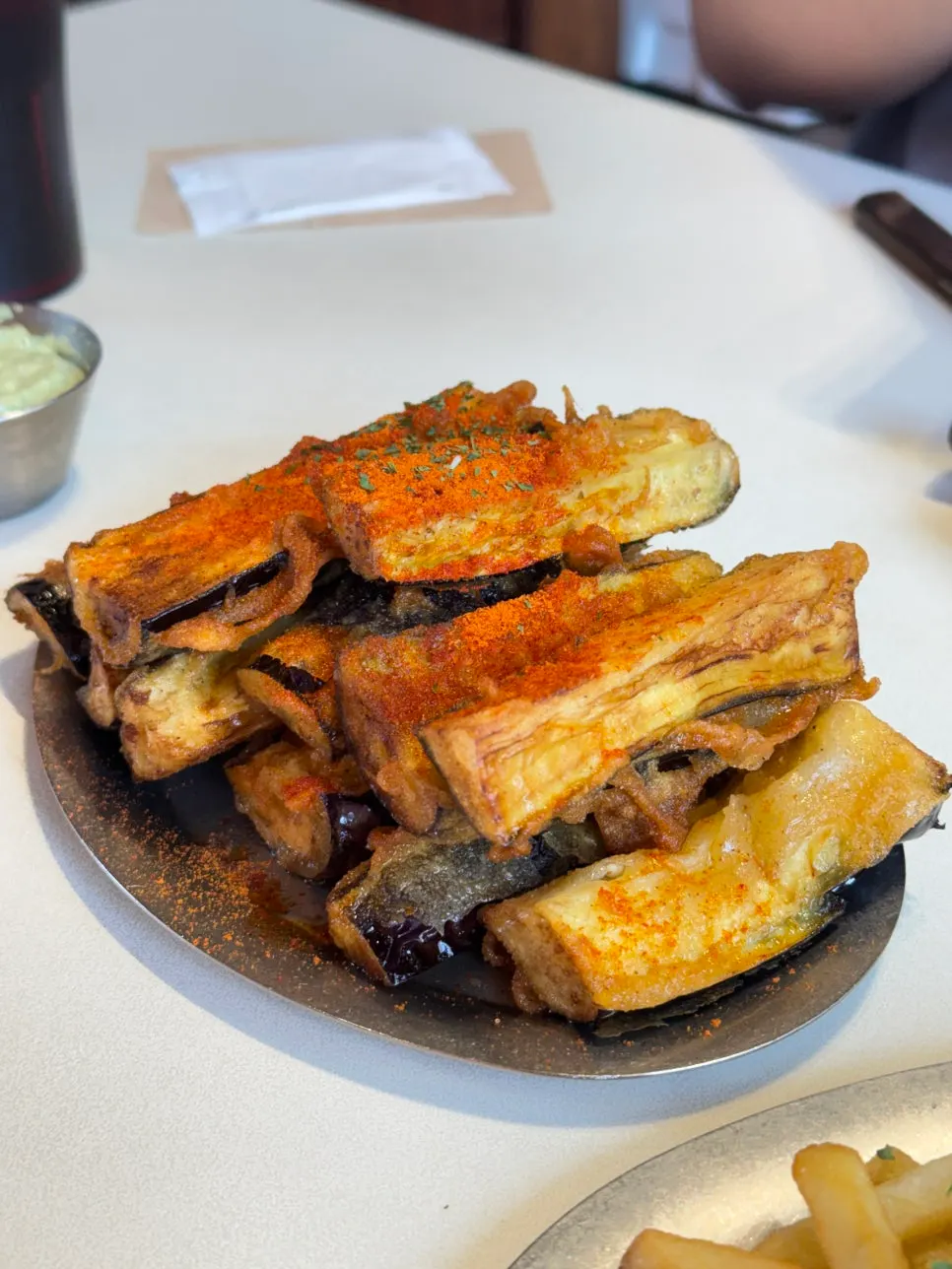 Fried eggplant topped with chili powder at Daily Fix