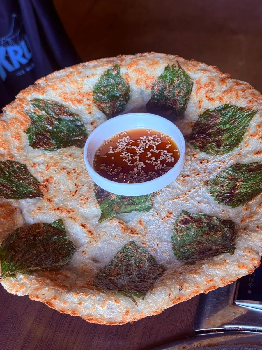 Picking up a bite of cheese dakgalbi