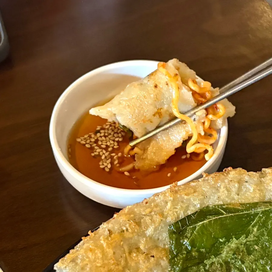 Dipping sauce served alongside the potato pancake