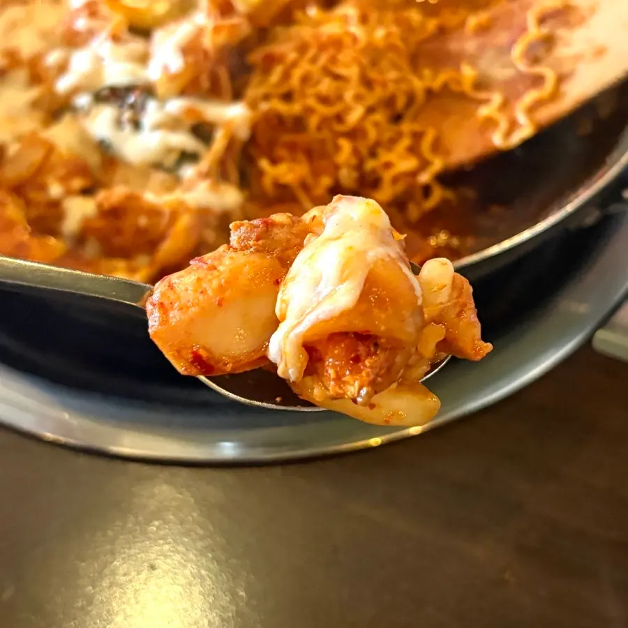 Wrapping the ramen sarita with the potato pancake