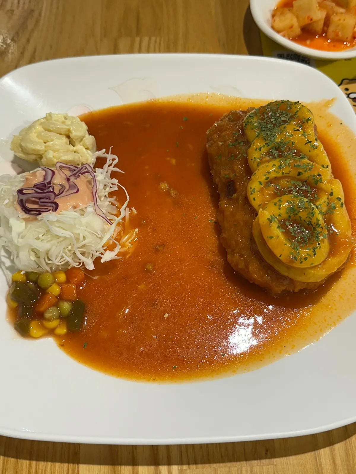 Close-up of sweet potato cheese pork cutlet with sauce