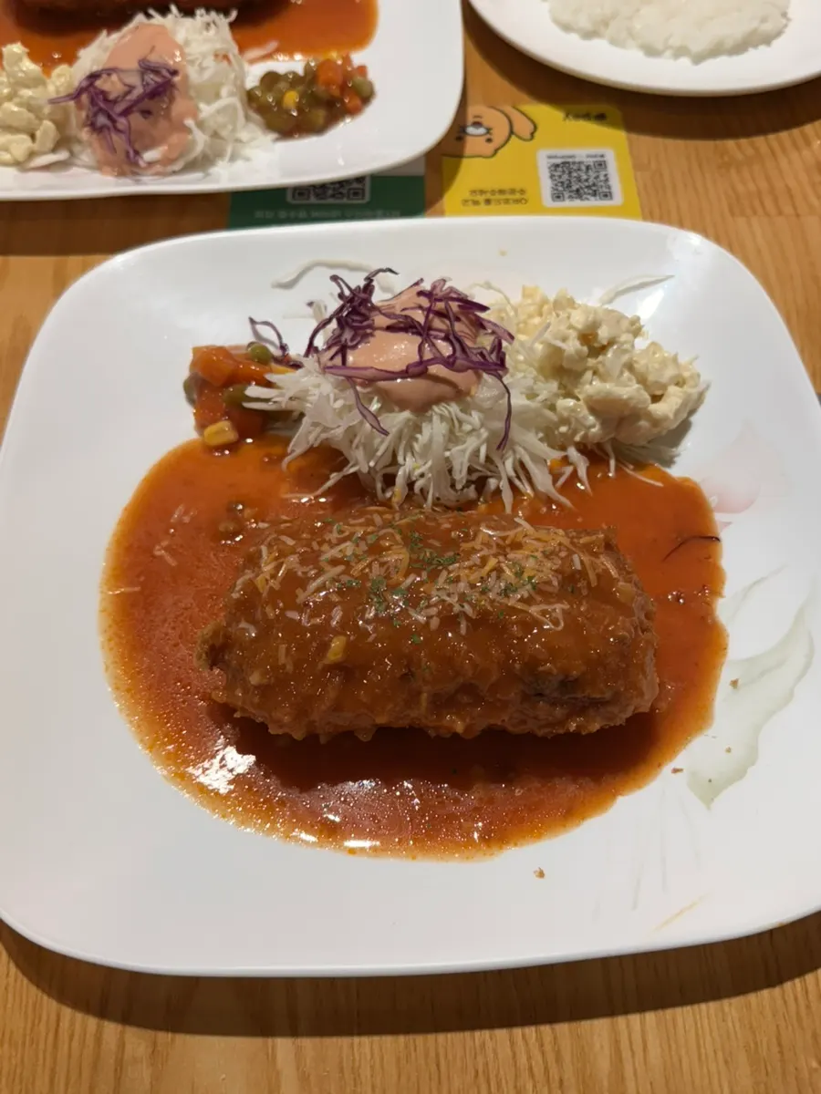 A plate of cheese king pork cutlet
