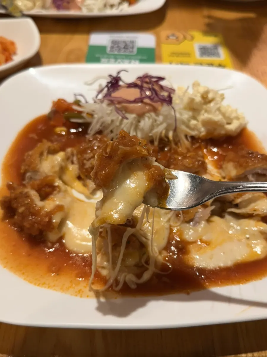 A bite of cheese king cutlet lifted up