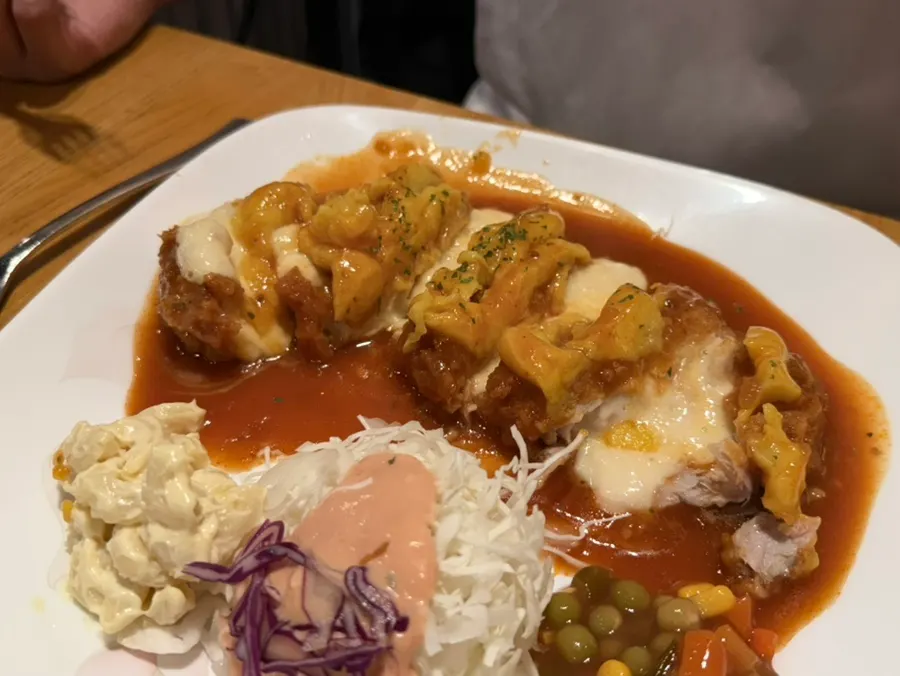 A piece of sweet potato cheese cutlet with gyeongyangsik sauce