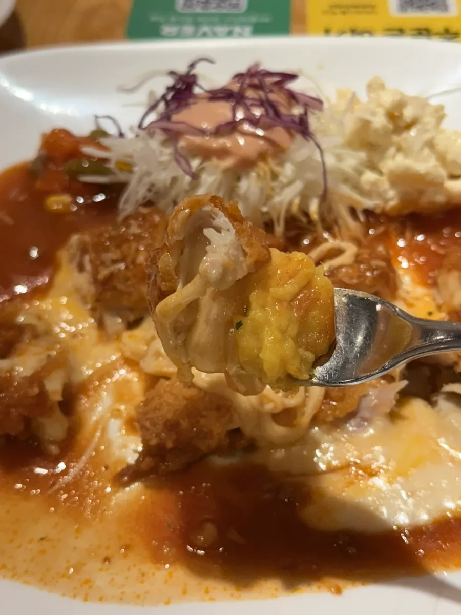A piece of pork cutlet dipped in sauce