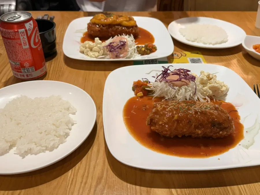 A table setting with pork cutlet and rice