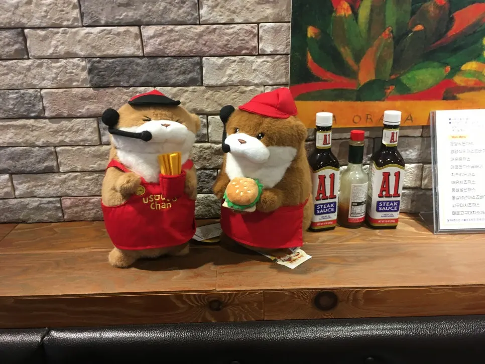 Dolls displayed on one side of the restaurant