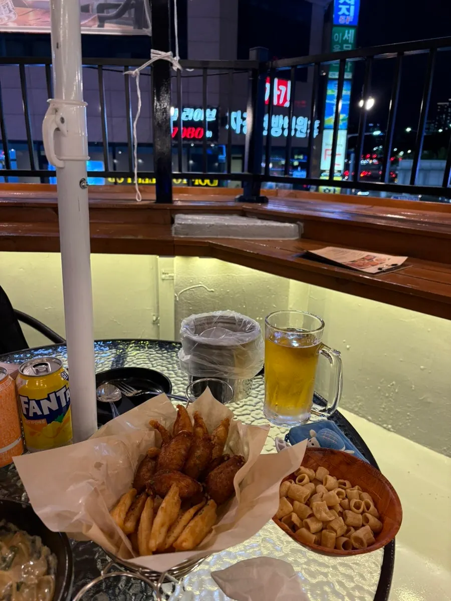 Pasta and fried side dishes served together on the table