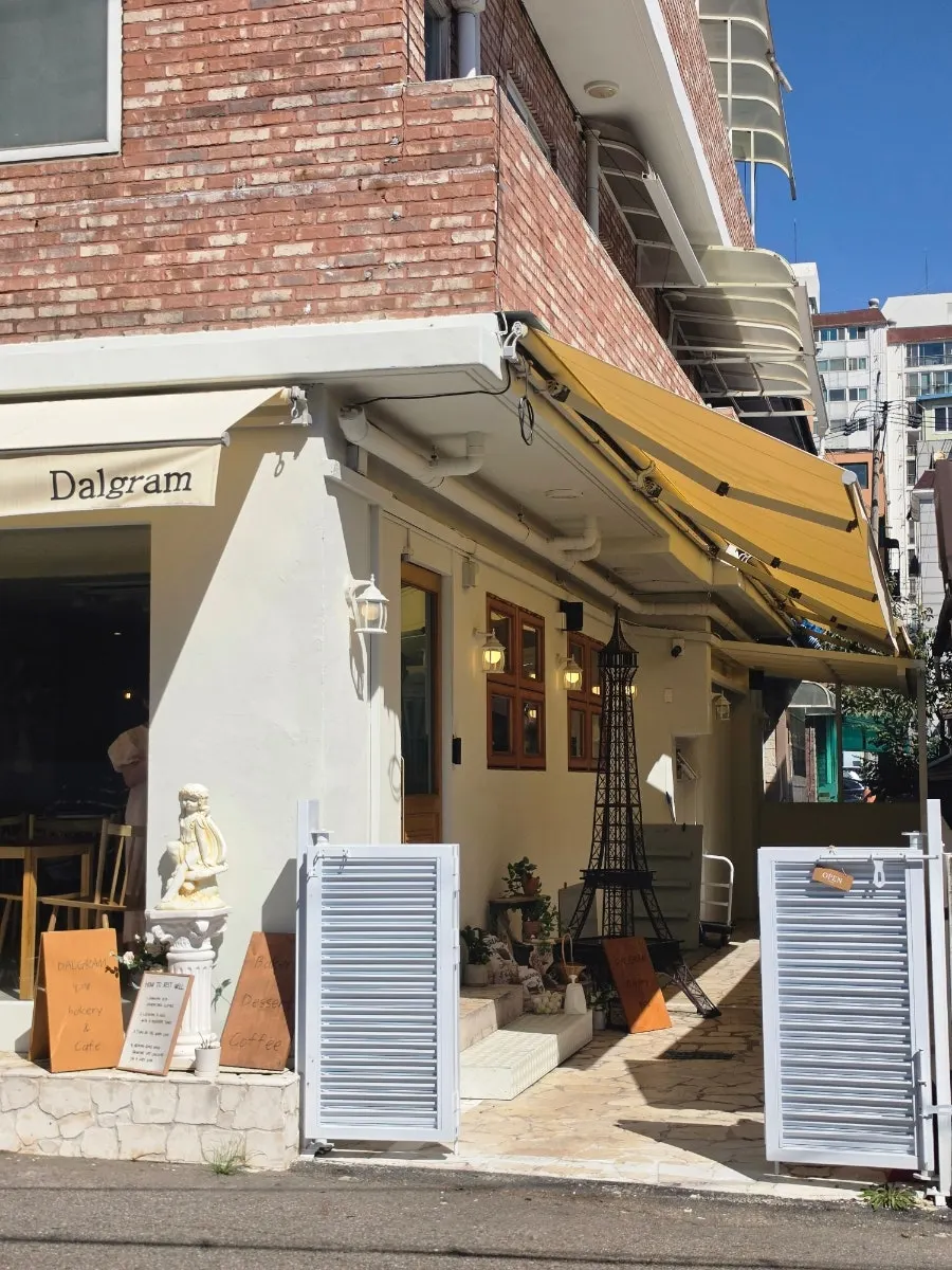 Dalgeuraem entrance with ivory facade and yellow awning