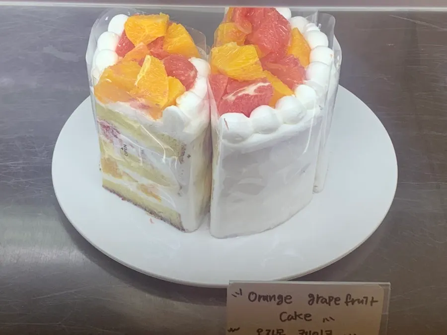 Refrigerated display case of cakes at Dalgeuraem