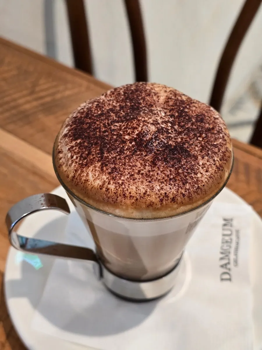 Close-up of cappuccino with foam covering the cup