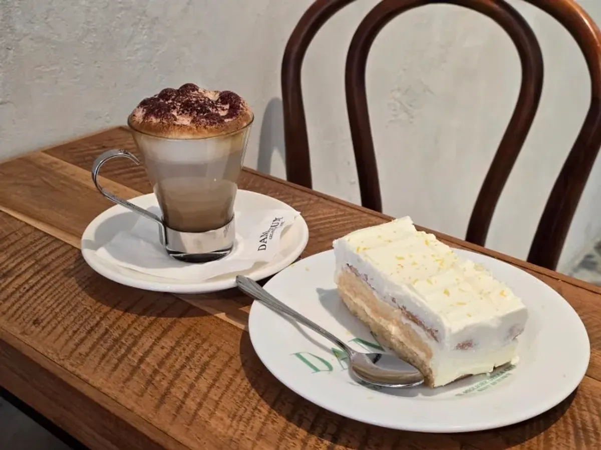 A cup of cappuccino on the café table