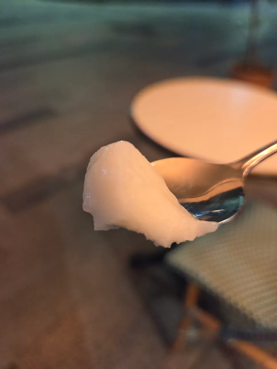 Gelato cup and spoon on the terrace table