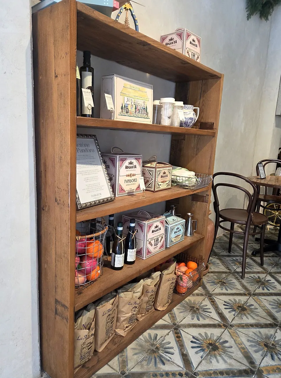 Classic chairs and tile flooring inside the café