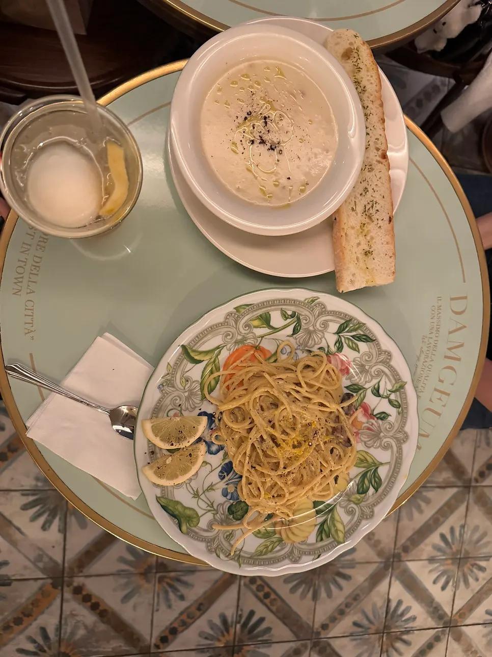 Fork lifting lemon carbonara noodles