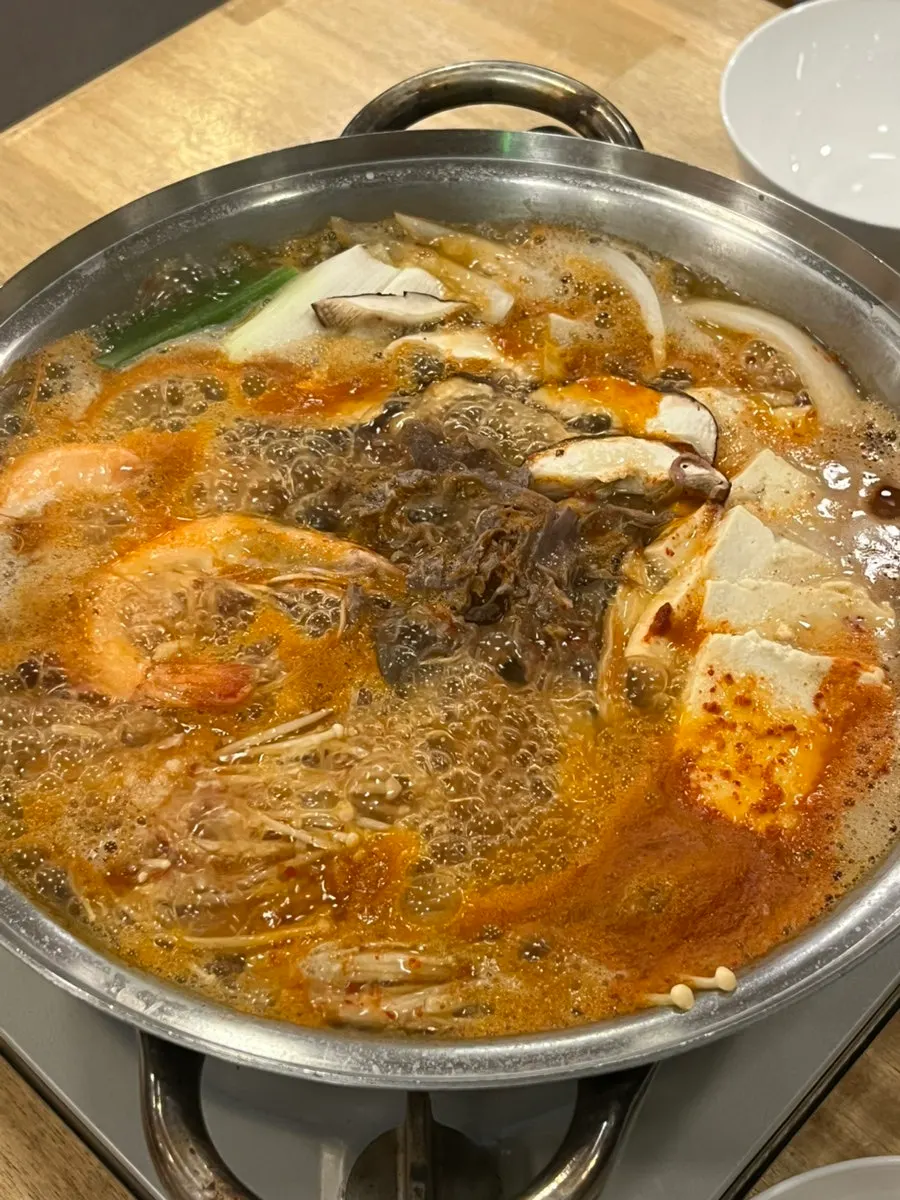 Tofu hot pot with shrimp, vegetables, tofu, and beef