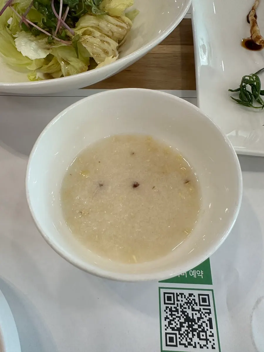 First course of the Special B menu: pine nut porridge and salad
