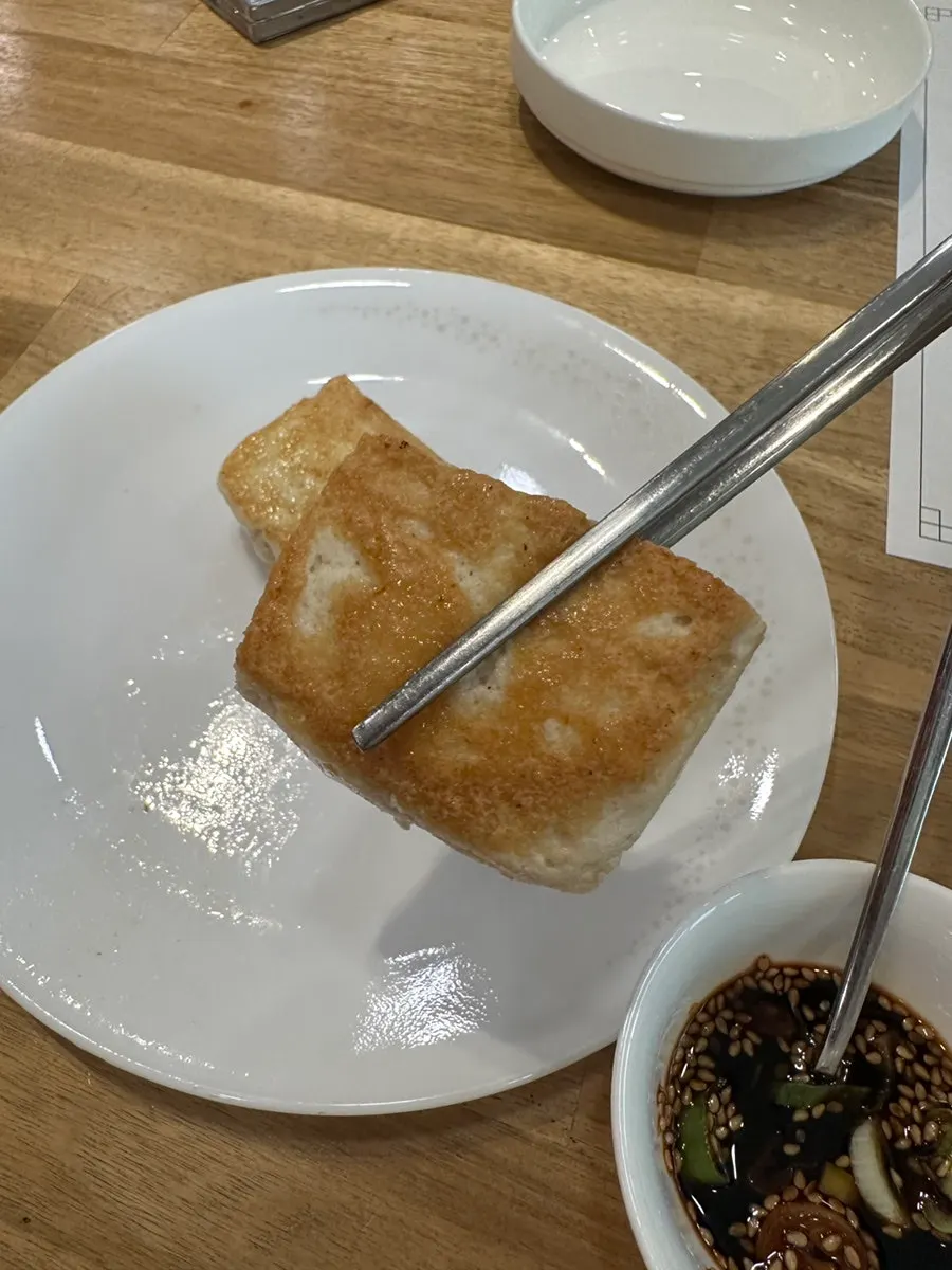 Plate of tofu steak served with soy sauce