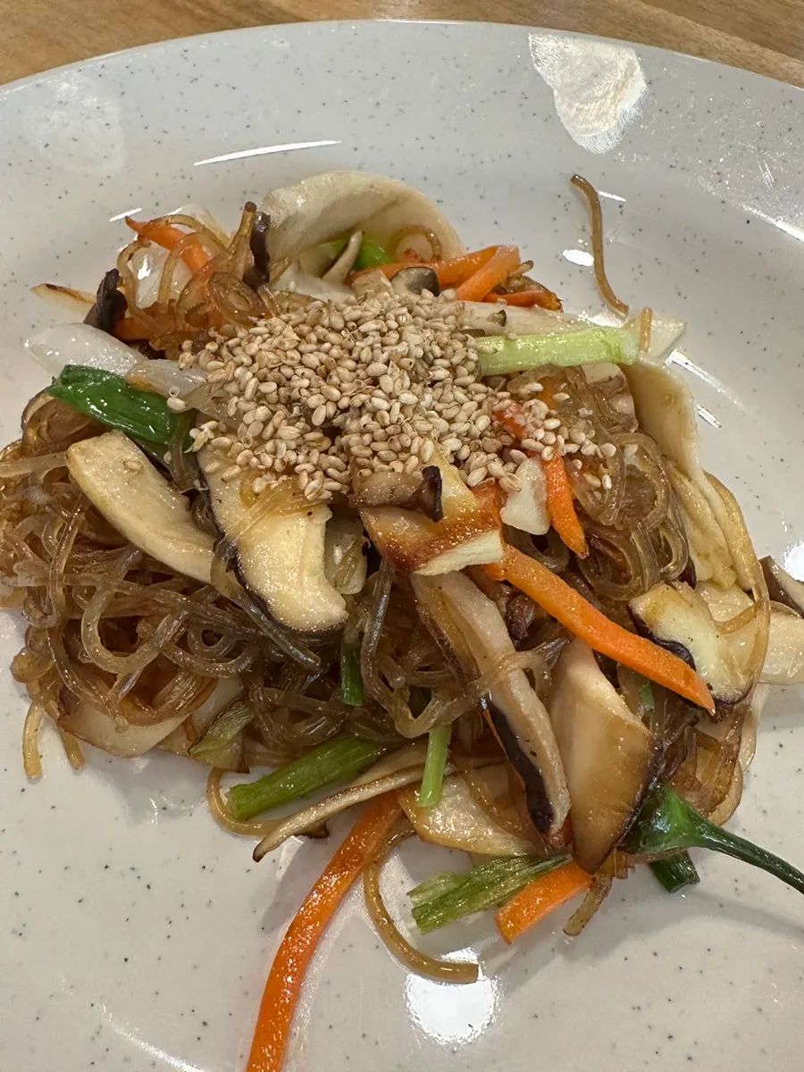 Bowl of japchae served as part of the course