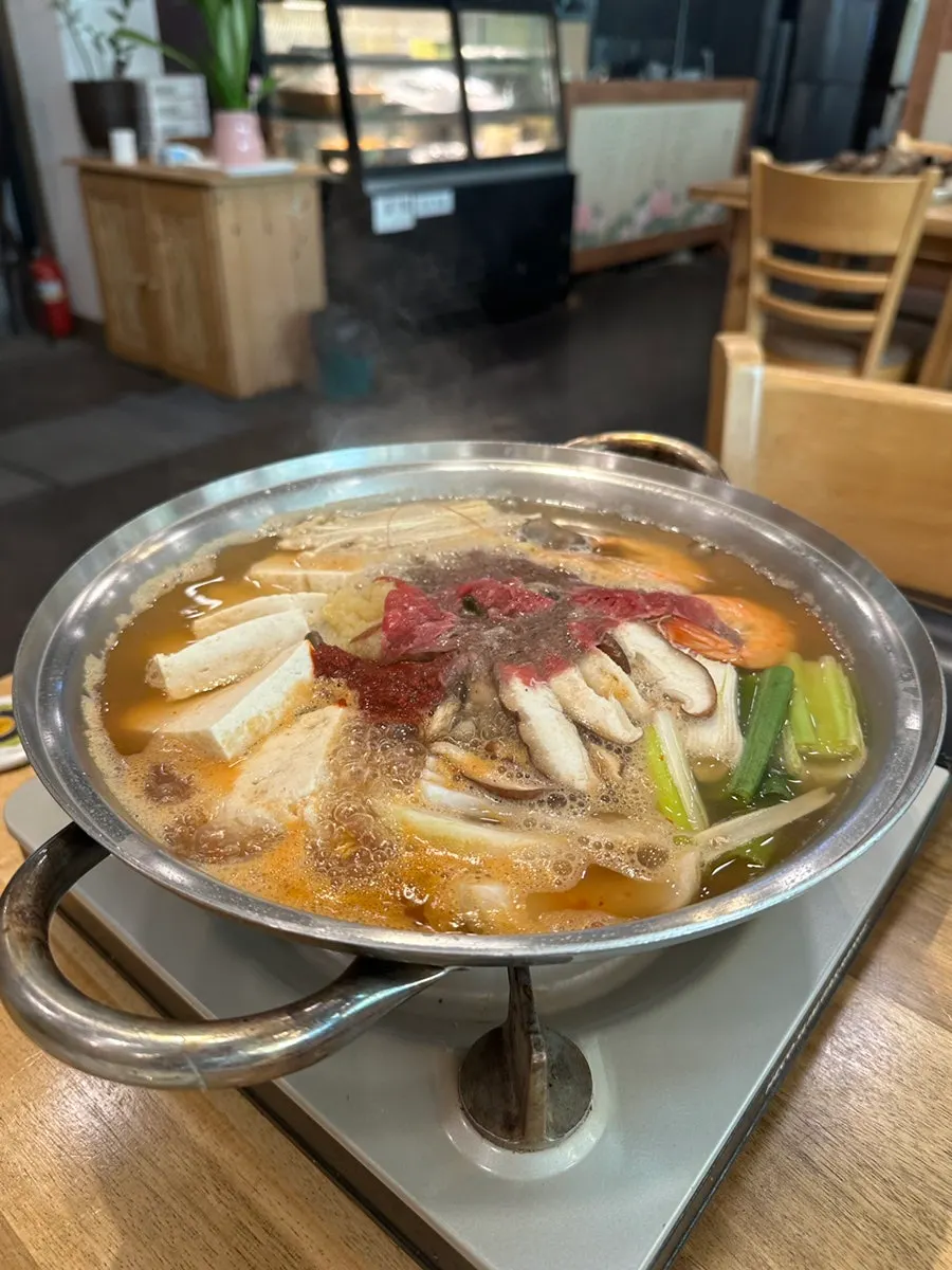A piece of LA galbi with the meat pulled from the bone