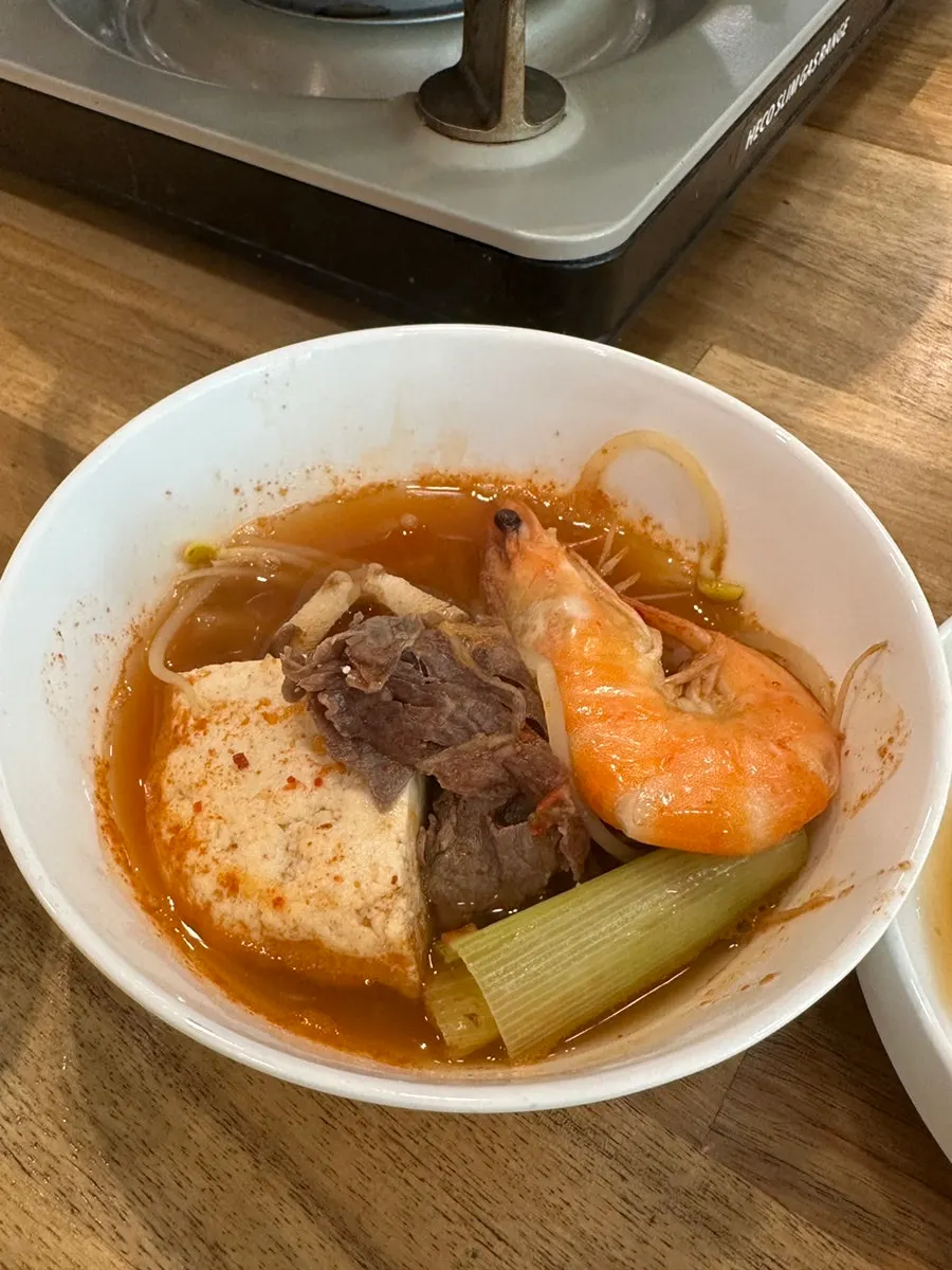 Tofu hot pot portioned into an individual bowl